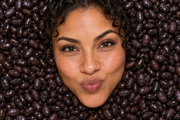 Woman with fiber rich beans for gut health
